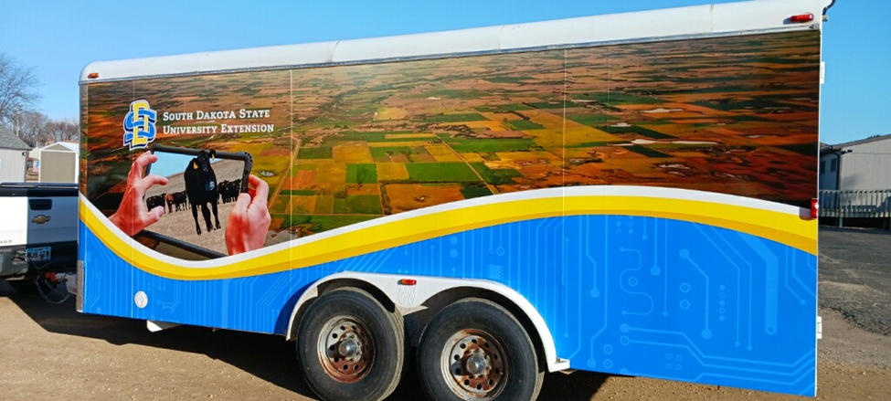 A trailer with the SDSU Extension logo and aerial footage of landscapes is shown