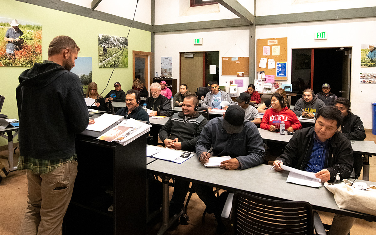 Instructor leading a proctored exam in an agriculture classroom.
