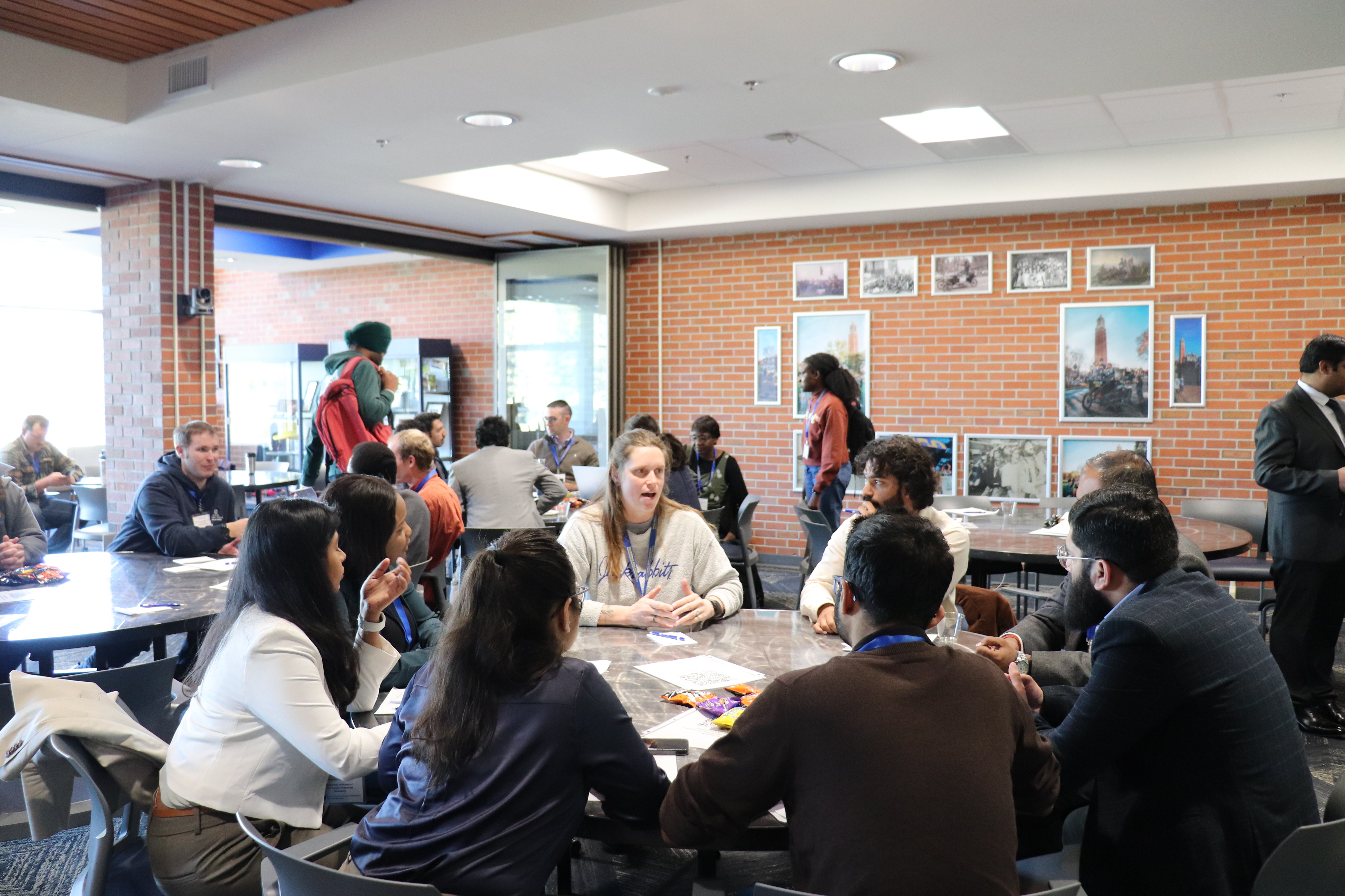 Group of college students sitting around a table having a discussion