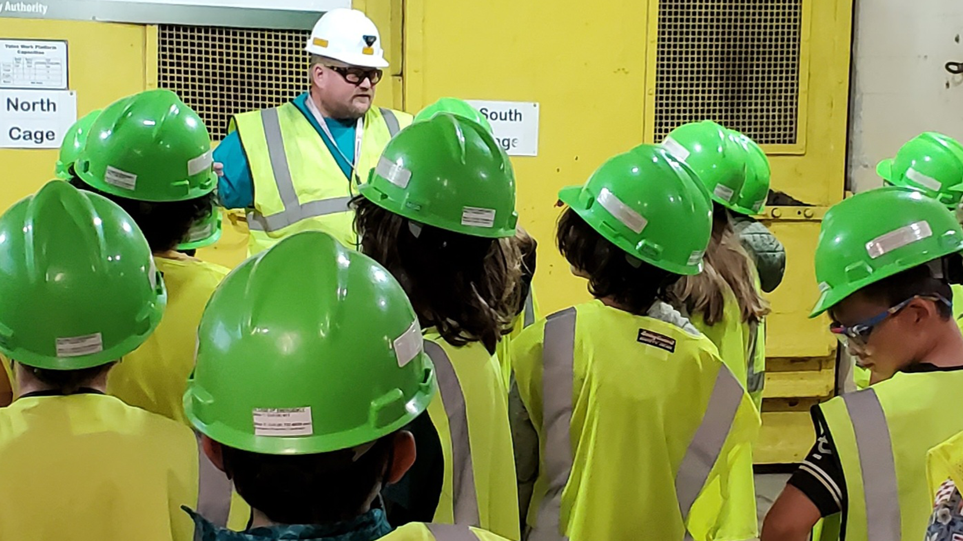 Group of youth learning from a tour guide at the Sanford Underground Research Facility