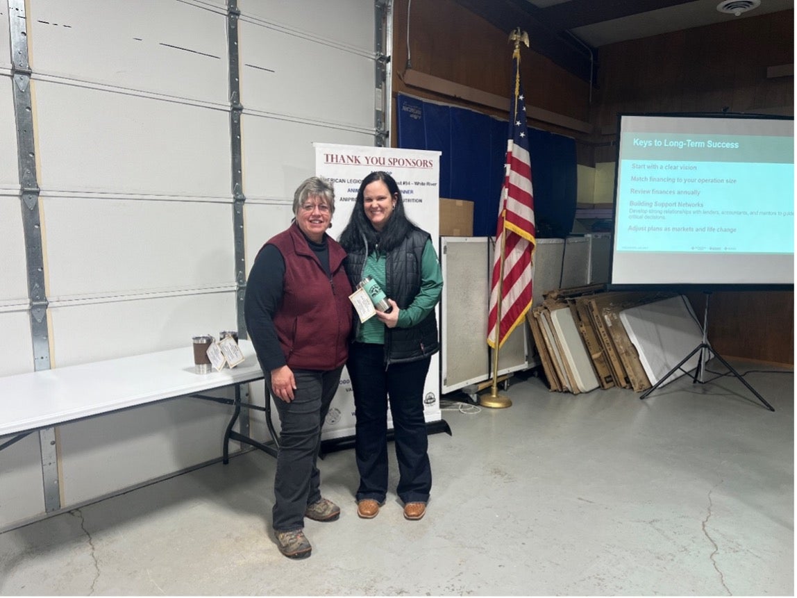 Two women smile for the camera