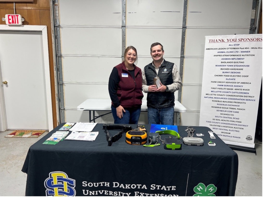 A man and a woman smile for the camera