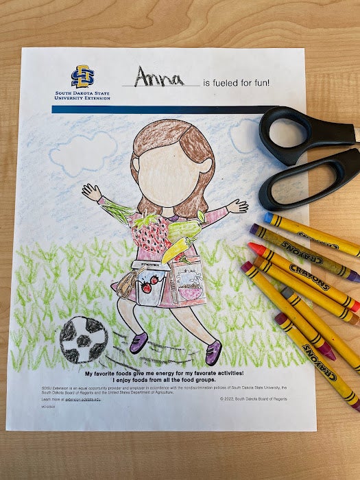 Fueled for Fun activity sheet colored with food options cut out and glued to the body