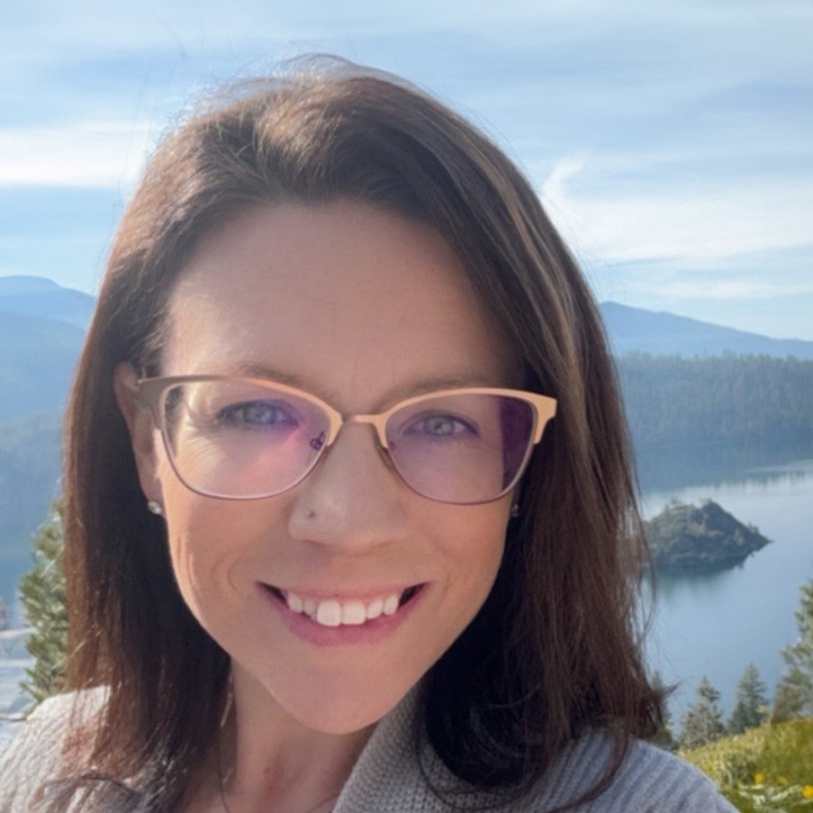 A woman smiles at the camera