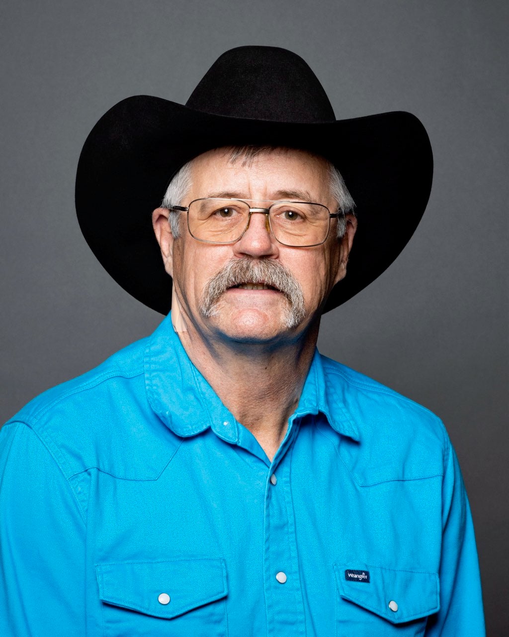 A man smiles at the camera