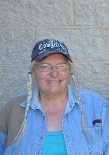 A woman smiles for a portrait