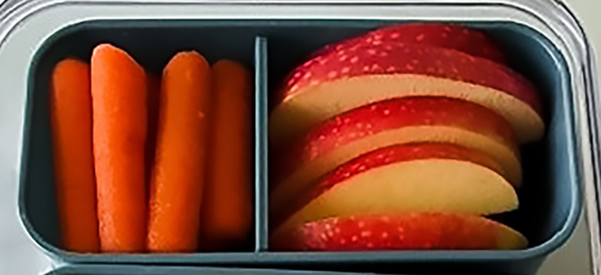 Snackle box cubes filled with carrots and apples.