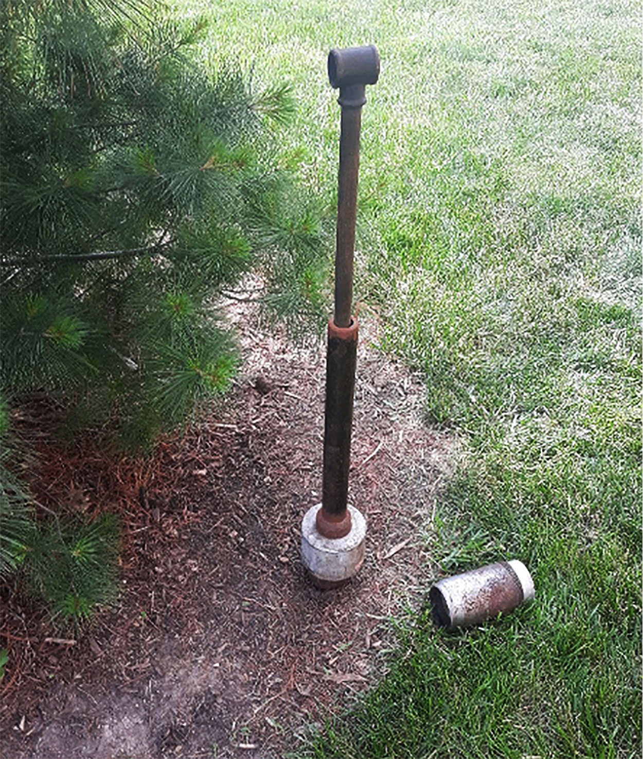 A soil coring device that has been pounded into ground
