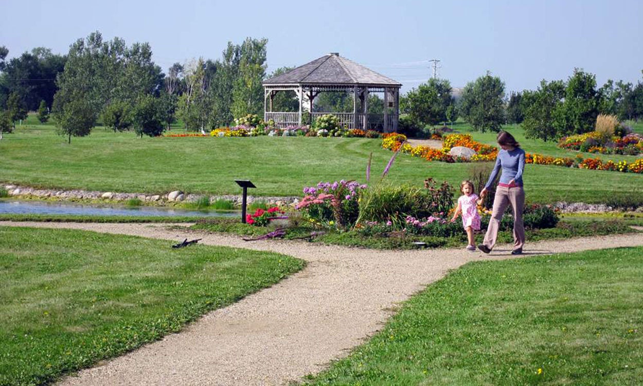 A mother and daughter exploring the Freeman Prairie Arboretum.