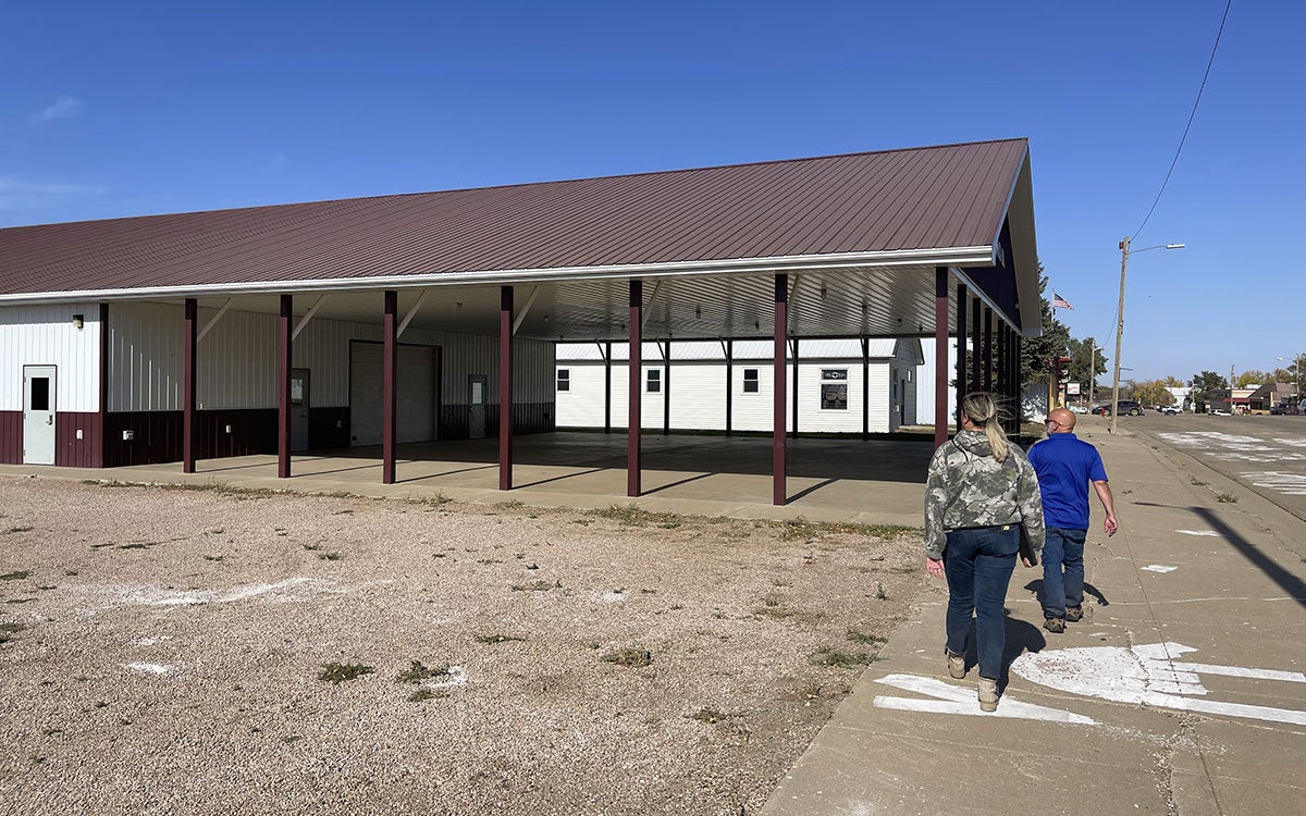 Two Healthy Landscapes, Healthy Communities Initiative team members walking down a street in Dupree, South Dakota.