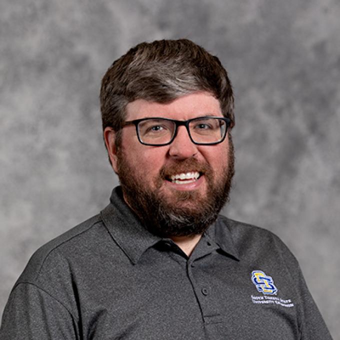 Professional headshot of Nathan Skadsen
