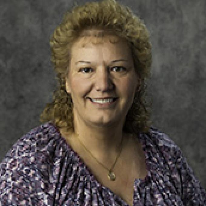Professional headshot of Jackie Rau