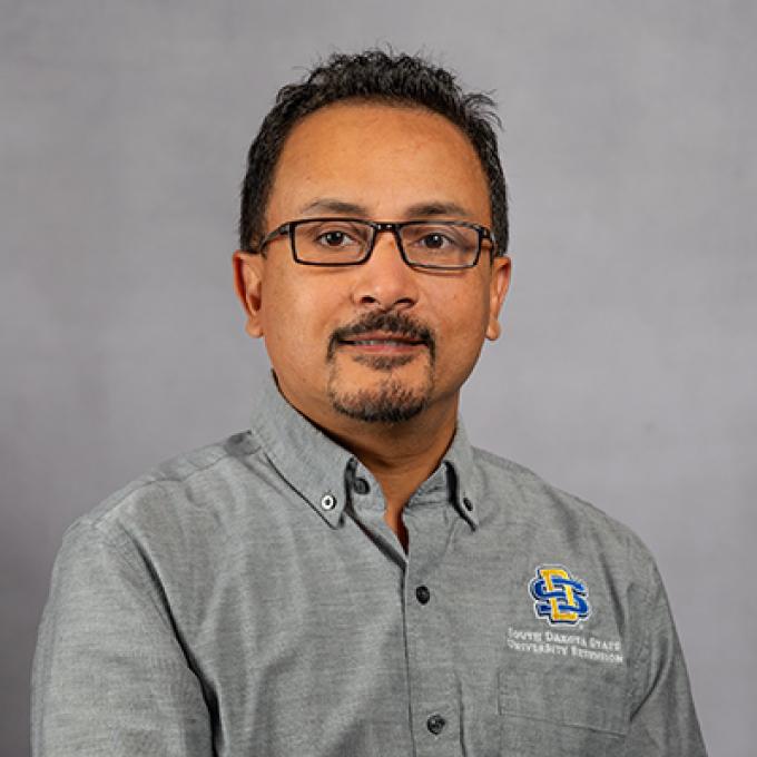 Professional portrait of David Karki