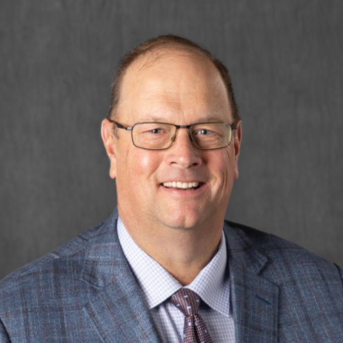 Professional portrait of Warren Rusche