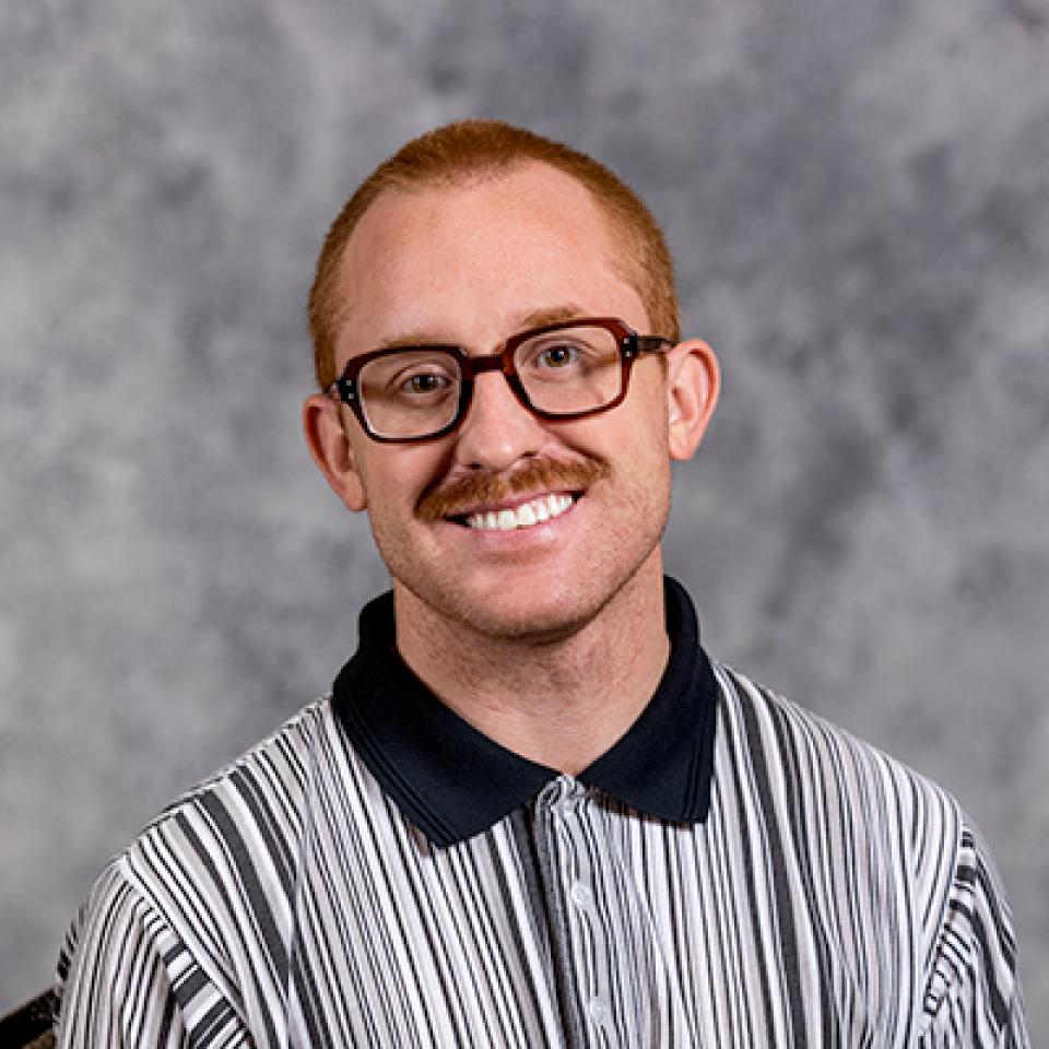 Professional headshot of Sam Jacomet