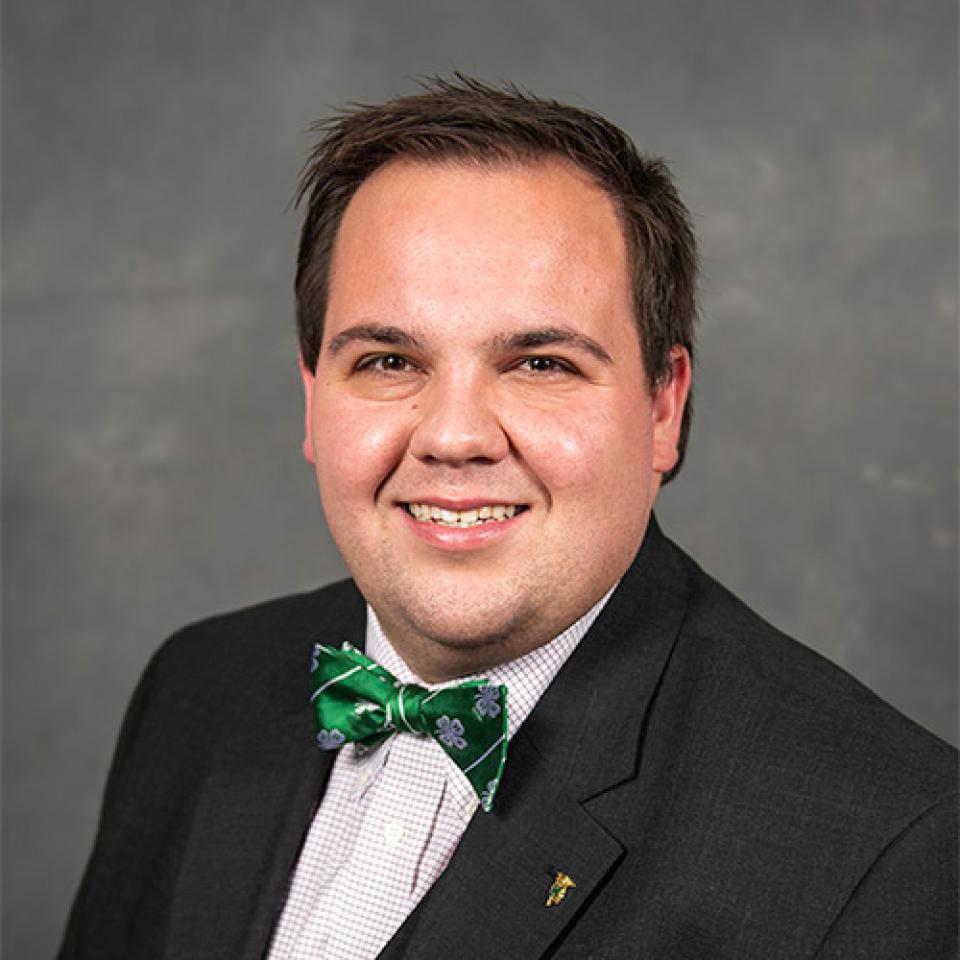 Professional headshot of Oakley Perry