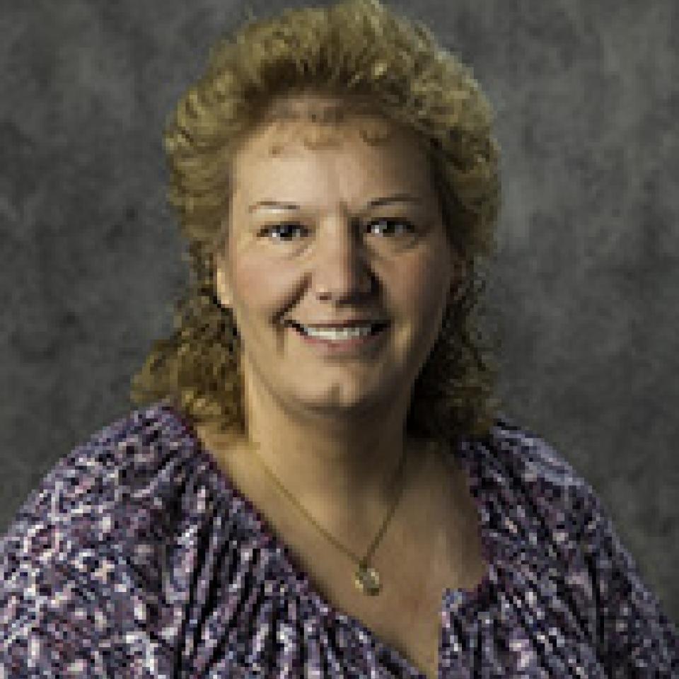 Professional headshot of Jackie Rau