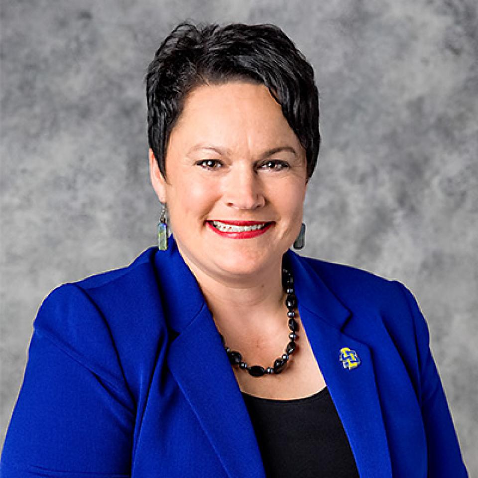 Professional headshot of Lora Berg