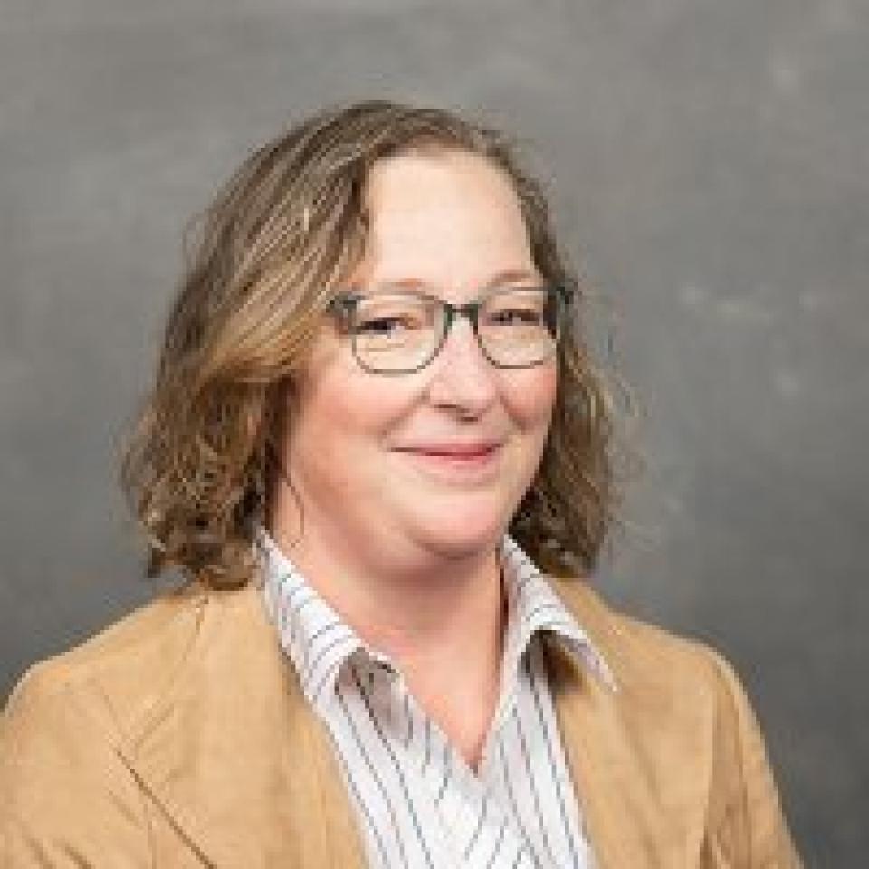 Professional portrait of Lora Perkins