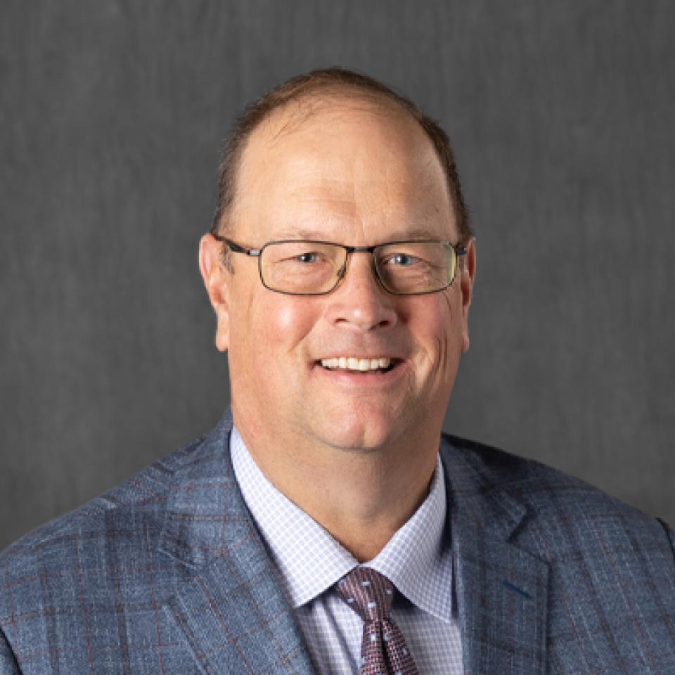 Professional portrait of Warren Rusche