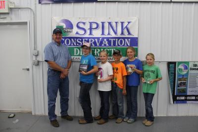 Jeff VanderWal, President of Spink Co. Conservation District,First place, Bobbie Eide, Potter County; second place, Katelyn Gebhart, Perkins County; third place, Tyler Warkenthien, Spink County; fourth place, Faith Baumberger, Hand County; and fifth place, Lila Johnson, Corson County.