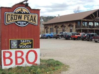 A large enterance sign at the Crow Peak Brewery.