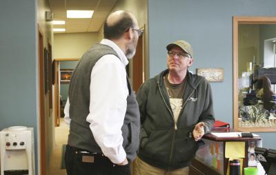 two men talking to each other