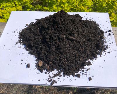 A pile of finished organic garden soil compost.
