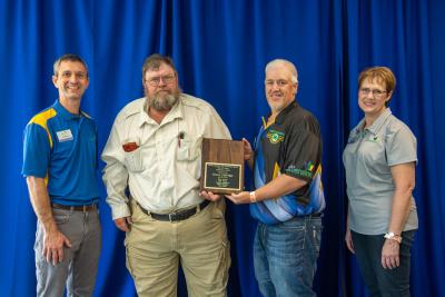 Bruce Eldridge receiving his 2019 Shooting Sports Hall of Fame plaque.