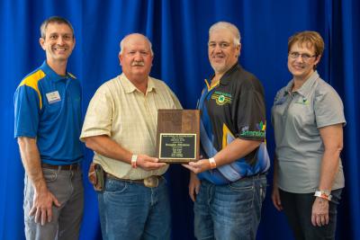 Doug Kittelson receiving his 2019 Shooting Sports Hall of Fame plaque.