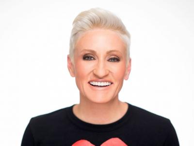 a smiling woman with a black shirt