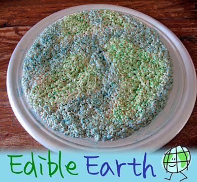 A round Rice Krispy treat decorated with blue and green coloring to resemble planet earth.