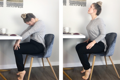 A young woman demonstrating the seated cat and cow yoga poses. Beginning in her seat, she raises her shoulders with her neck bend over. The she slowly lowers her shoulders and raises her neck and head upright.