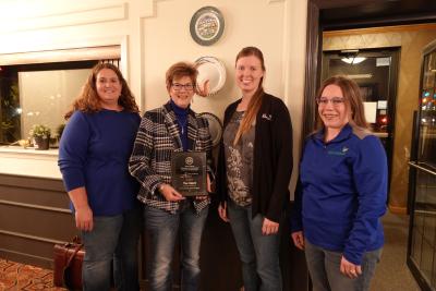 Adele Harty, Sara Bauder and Connie Strunk, pose with Pam Geppert, winner of the Friend of SDAAEP award.