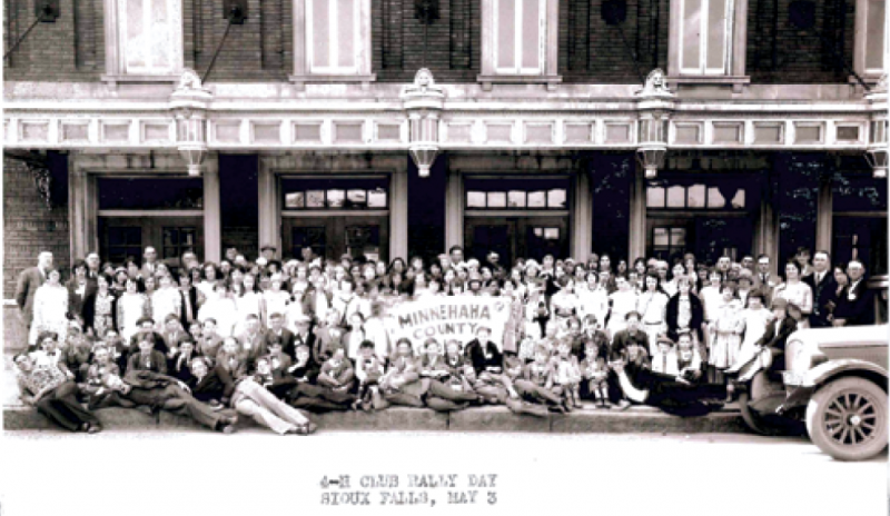 Members of the Minnehaha County 4-H club group photo in front of a building. May 3, 1930 Sioux Falls, SD