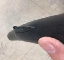 A hand demonstrating an air gap piece.