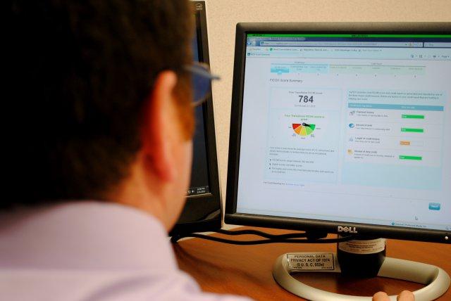 Man checking credit score on computer.