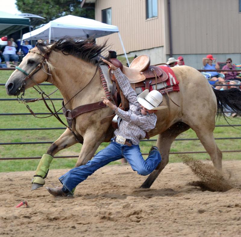 male youth running with a sandy-brown horse