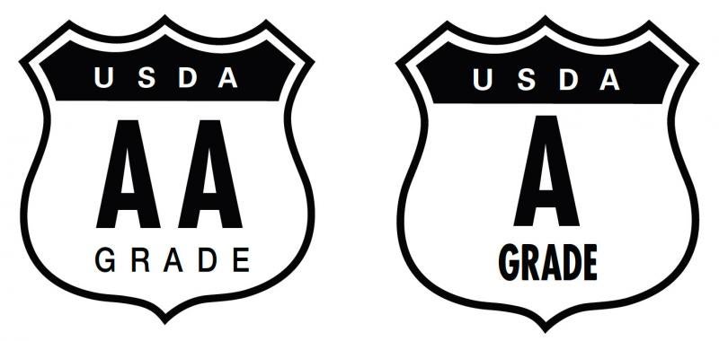 Two black-and-white, shield-shaped, USDA Egg Grade seals. The seal on the left reads, "USDA A A Grade." The seal on the right reads "USDA A Grade."