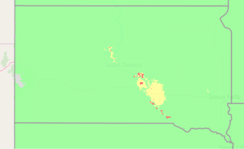 A color-coded map of South Dakota. The majority of the map is green, with a small patch of yellow and some specs of red in the East, South Central part of the state.