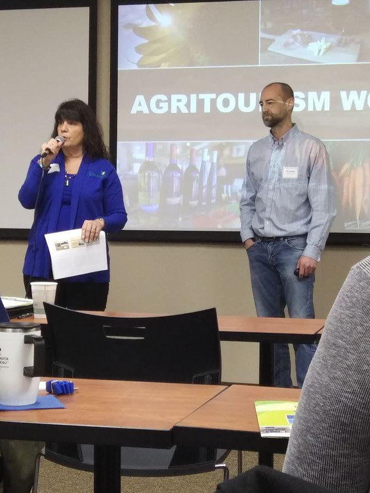 a man and a woman presenting at a conference