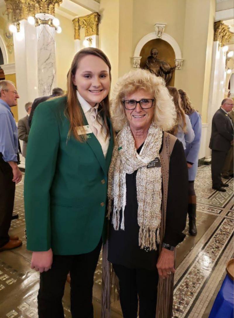 two women standing together in the Capitol hall