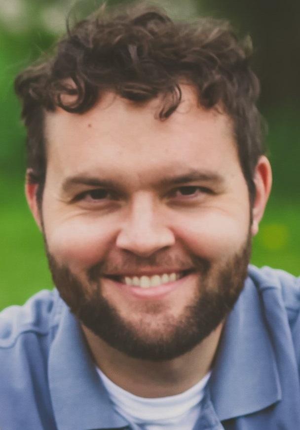 a headshot of Joshua Hofer