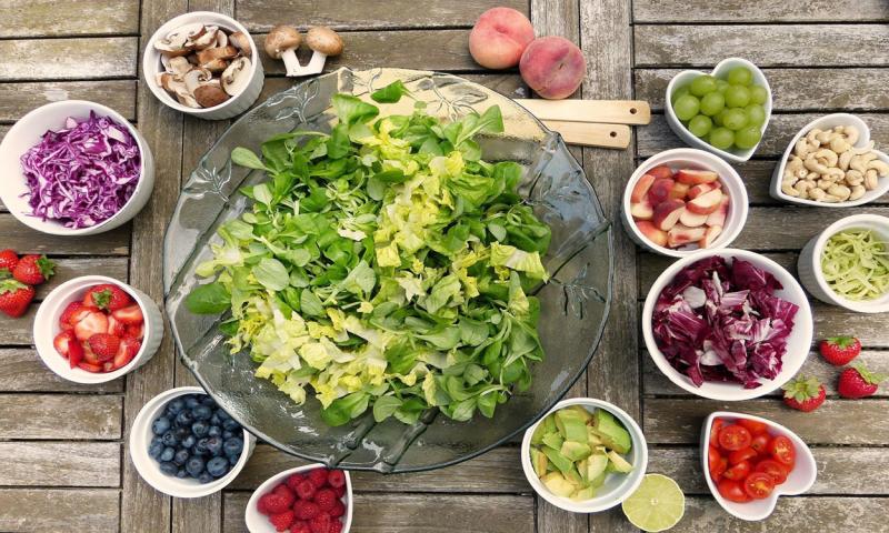 Salad ingredients arranged on a table.