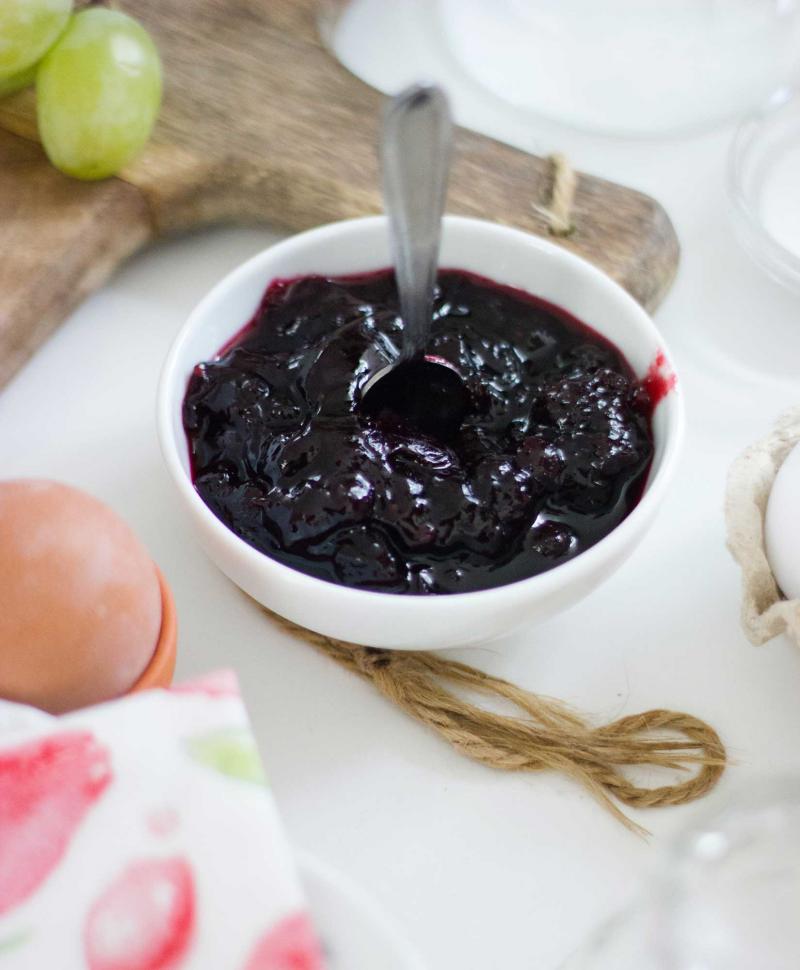 Berry jelly in a white dish.