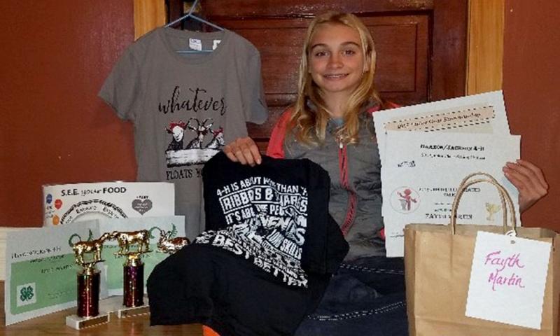 Fayth Martin posing with her many 4-H awards.