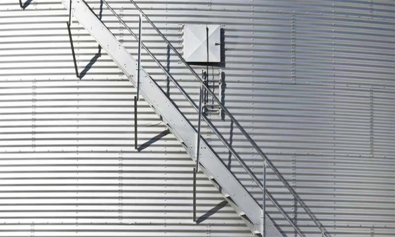 Modern grain bin exterior with built-in staircase.
