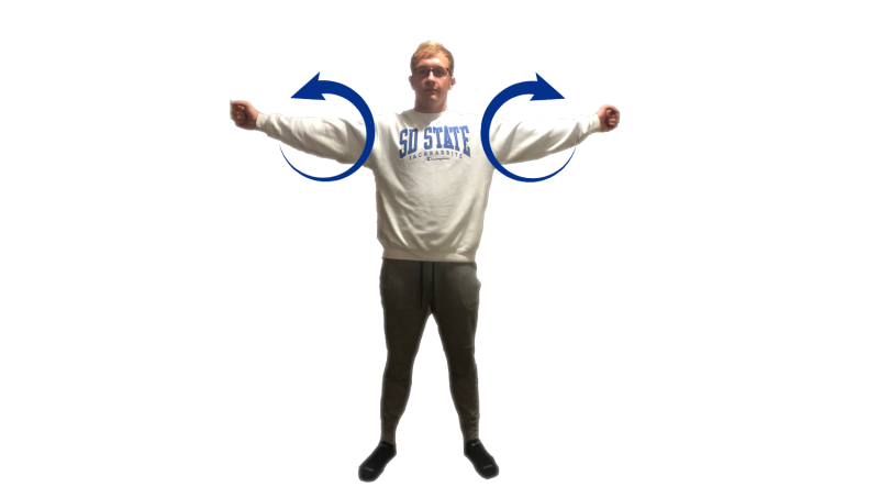 Young man demonstrating the shoulder circles exercise. For a complete description, call SDSU Extension at 605-688-4792.