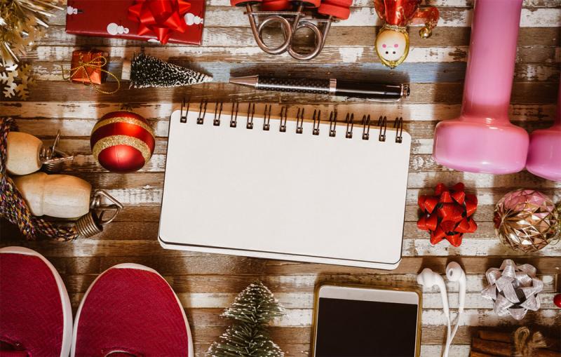 Holiday decorations and fitness equipment arranged on a tabletop.