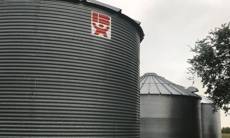Three grain storage bins.
